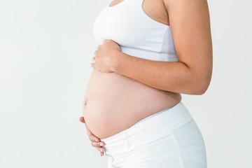 Pregnant woman touching belly