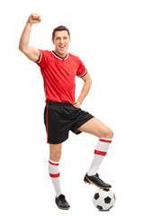 Fototapeta na wymiar Joyful football player gesturing happiness