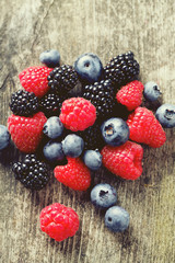 summer berries on wooden surface