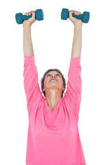 Mature woman exercising with dumbbells