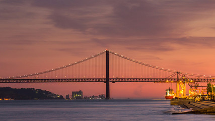 Sunset over 25 de Abril Bridge in Lisbon Portugal