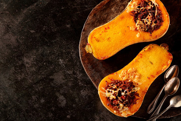 Halved roasted butternut with spicy filling