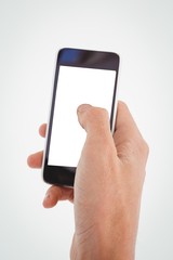 Cropped hand of man using mobile phone