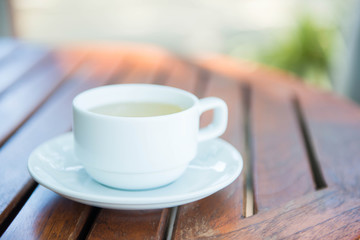 hot ginger tea in a white cup