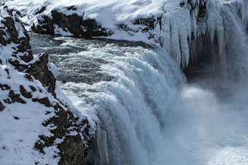 Closeup of frozen waterfall Godafoss, Iceland