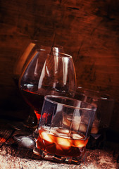 Set of hard liquor brandy, whiskey, brandy and vodka on the old