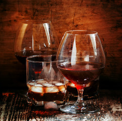 Set of hard liquor brandy, whiskey, brandy and vodka on the old