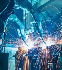 Welding robots movement in a car factory