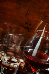 Set of hard liquor brandy, whiskey, brandy and vodka on the old