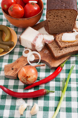 Salted lard with bread ,onion,pepper and pickled tomatoes 