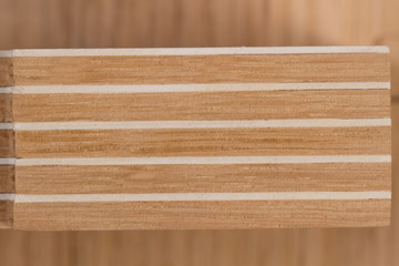 Sandwich panel on a wooden surface. Workshop scale models. 