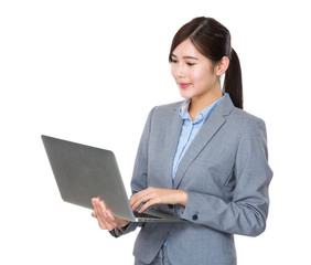 Asian Businesswoman use of the laptop computer