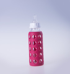 baby glass bottle. baby glass bottle on a background.