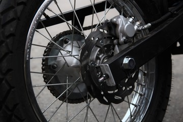 Motorcycle wheel in black and white. Street