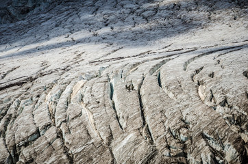 Rescuers walk on the surface of the glacier