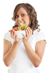 Young woman eating healhty salad