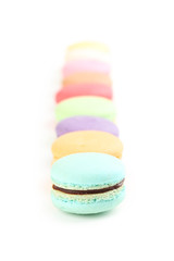 French colorful macarons isolated on white