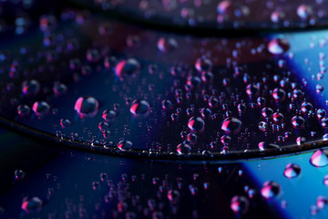 Water drops on cd, close up