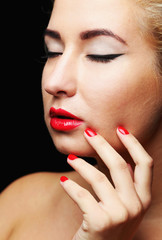 Fototapeta premium Beautiful model with make-up, red lips and manicure