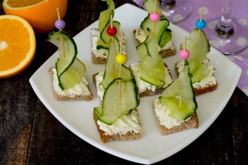 Rolgordijnen Appetizer canape sandwich with cucumber and cheese curd © elena_hramowa