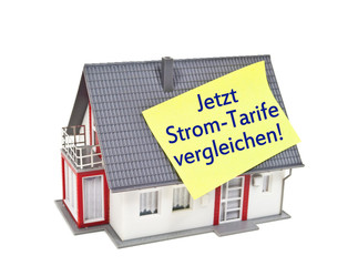 Haus und Taschenrechner mit Stromtarife und Gastarife vergleichen