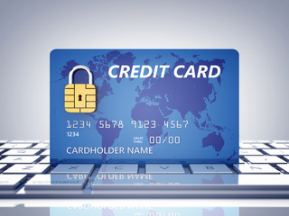 Credit card with security chip as padlock on a computer keyboard , Safe online shopping