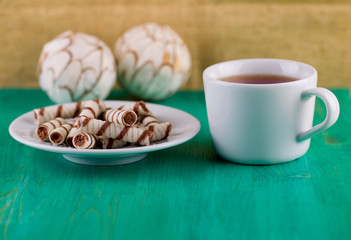 Wafer tubules and tea on a table