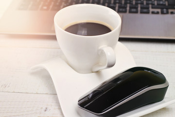 Laptop and cup of coffee. Office, Workplace, business meeting concept