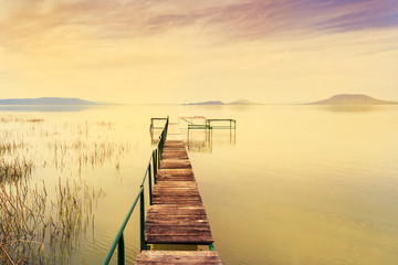 Naklejka na ściany i meble Wooden pier in tranquil lake Balaton