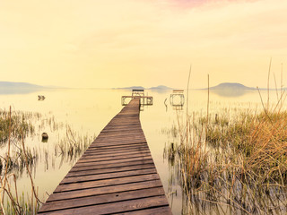 Obraz na płótnie Canvas Wooden pier in tranquil lake Balaton