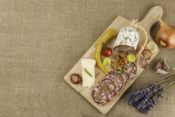 Delicious specialty food, salami with walnuts. Refreshments for important guests. Traditional specialty food. Preparation of home entertainment.
