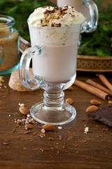 Cocoa with whipped cream, nuts and chocolate 