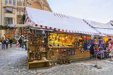 Christmas market stall with traditional souvenirs for sale in Riga, Latvia