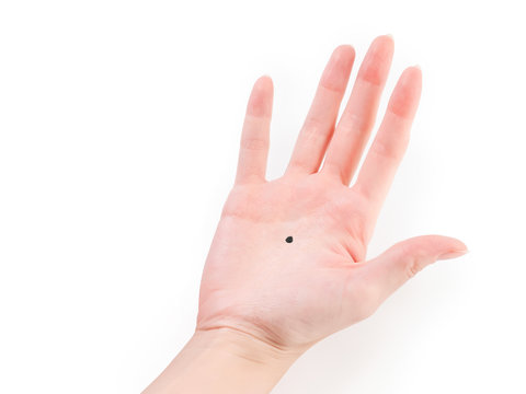 woman hand with black dot