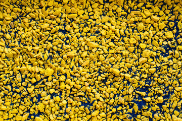 Mixture of Small Yellow and Blue Stones Background