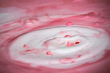 Splash of milk drop in pink color.