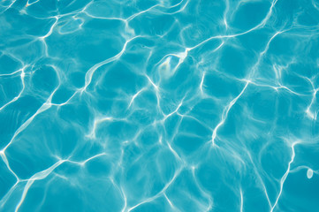 Fototapeta na wymiar Detail rippled water surface in swimming pool