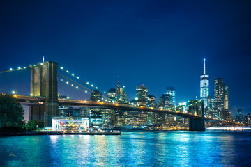 Beautiful night scene of New York City and Brooklyn Bridge looking toward Manhattan