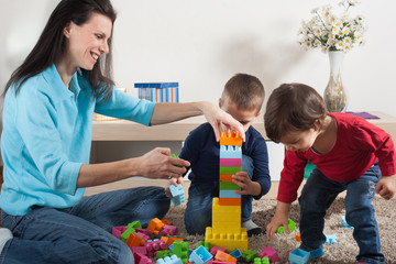 Obraz premium Family play with toys