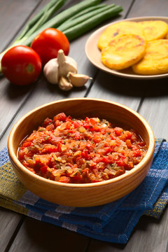 Colombian hogao or criollo sauce (salsa criolla) made of cooked onion and tomato, served as accompaniment, photographed with natural light (Selective Focus, Focus in the middle of the sauce)
