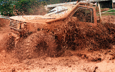 Scene of mud splash in off-road racing. © chokchaipoo