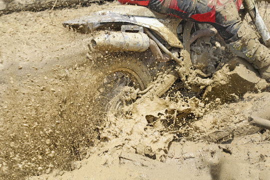 Motocross accelerating speed in mud