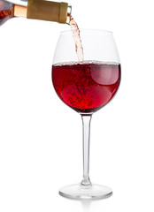 Red wine being poured into glass 