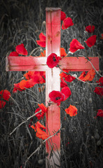 Remembrance Day - wooden cross with poppies and barb wire