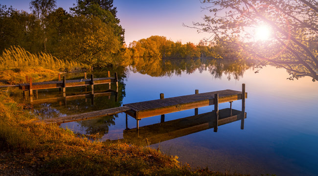 Wooden Jetty on a Becalmed Lake at Sunset