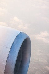 Clouds and sky as seen through window of an aircraft