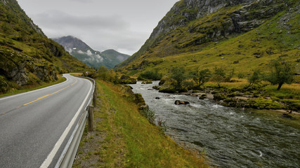 Road along the river. Norwegian mountains