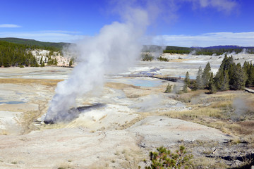 Yellowstone National Park is a volcanically active area, filled with geothermal activity of steam vents, hot springs and geysers