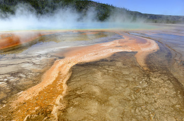 Yellowstone National Park is a volcanically active area, filled with geothermal activity of steam vents, hot springs and geysers, such as the Grand Prismatic Spring