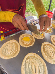 Tokyo snack. Egg and chicken with sausage wrapped up with flour.